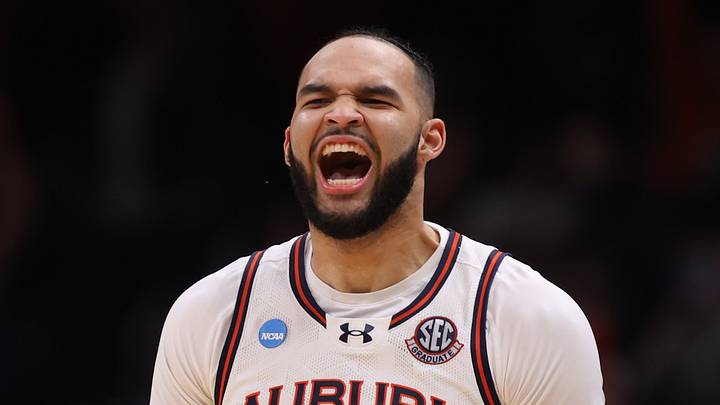 Auburn Tigers forward Johni Broome (4) celebrates after a play during the second half in the South Regional final of the 2025 NCAA tournament against the Michigan State Spartans at State Farm Arena on March 30, 2025.