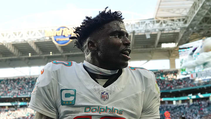 Dec 8, 2024; Miami Gardens, Florida, USA; Miami Dolphins wide receiver Tyreek Hill (10) celebrates after defeating the New York Jets during overtime at Hard Rock Stadium. Mandatory Credit: Jasen Vinlove-Imagn Images