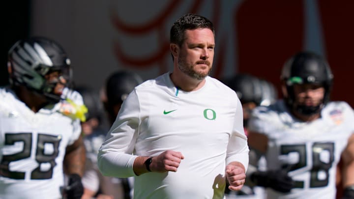 Oregon head coach Dan Lanning takes the field with his team for warmups as the Oregon Ducks take on the Texas Tech Red Raiders in the Orange Bowl on Jan. 1, 2026, at Hard Rock Stadium in Miami, Florida.