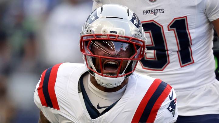 Sep 9, 2026; Seattle, Washington, USA;  New England Patriots defensive end Dre'Mont Jones (5) reacts after sacking Seattle Seahawks quarterback Sam Darnold (14) during the first quarter at Lumen Field.  Mandatory Credit: Joe Nicholson-Imagn Images