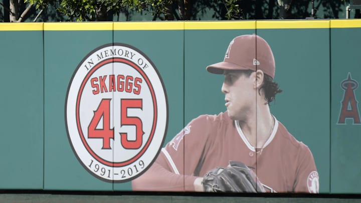 Jul 17, 2019; Anaheim, CA, USA; Detailed view of a memorial for Los Angeles Angels pitcher Tyler Skaggs on the outfield wall  at Angel Stadium of Anaheim. Skaggs, 27, died at a hotel in Southlake, Texas, July 1, 2019, where he was found unresponsive prior to a game against the Texas Rangers. Mandatory Credit: Kirby Lee-Imagn Images