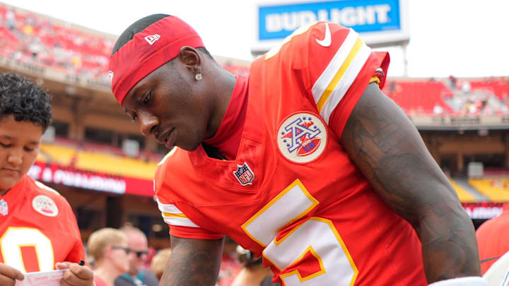 Sep 14, 2025; Kansas City, Missouri, USA; Kansas City Chiefs wide receiver Hollywood Brown (5) signs an autograph prior to the game against the Philadelphia Eagles at GEHA Field at Arrowhead Stadium. Mandatory Credit: Jay Biggerstaff-Imagn Images
