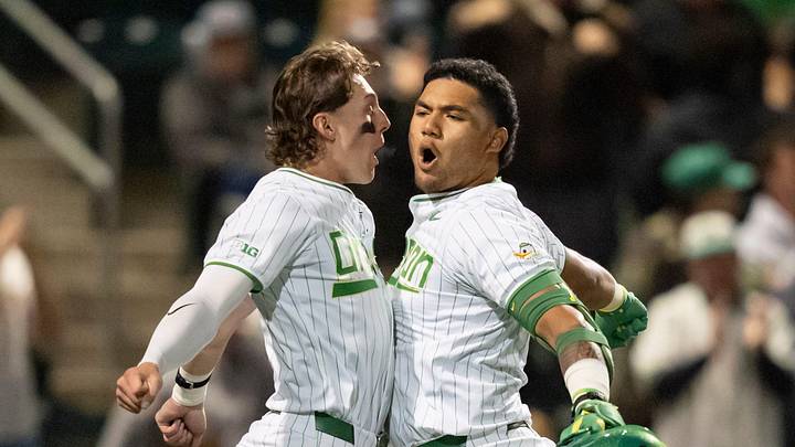 Oregon’s Drew Smith, left, and Naulivou Lauaki Jr. celebrate a home run by Lauaki as the Oregon Ducks host the USC Trojans on May 14, 2026, in Eugene, Oregon.