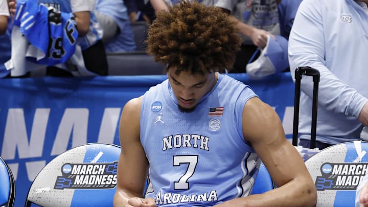 Mar 18, 2025; Dayton, OH, USA; North Carolina Tar Heels guard Seth Trimble (7) signs a “March Madness” towel in the second half against the San Diego State Aztecs   at UD Arena. Mandatory Credit: Rick Osentoski-Imagn Images