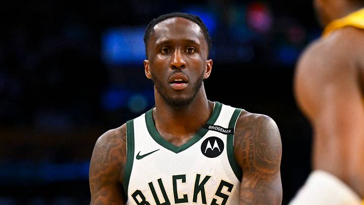 Los Angeles, California, USA; Milwaukee Bucks forward Taurean Prince (12) passes against Los Angeles Lakers guard Bronny James (9) during the first half at Crypto.com Arena. 