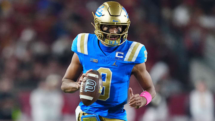 Nov 29, 2025; Los Angeles, California, USA; UCLA Bruins quarterback Nico Iamaleava (9) carries the ball against the Southern California Trojans in the first half at United Airlines Field at Los Angeles Memorial Coliseum. Mandatory Credit: Kirby Lee-Imagn Images Nov 29, 2025; Los Angeles, California, USA; UCLA Bruins quarterback Nico Iamaleava (9) carries the ball against the Southern California Trojans in the first half at United Airlines Field at Los Angeles Memorial Coliseum. Mandatory Credit: Kirby Lee-Imagn Images