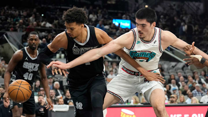 Jan 15, 2025; San Antonio, Texas, USA; San Antonio Spurs center Victor Wembanyama (1) and Memphis Grizzlies center Zach Edey (14) battle for a loose ball during the first half at Frost Bank Center. Jan 15, 2025; San Antonio, Texas, USA; San Antonio Spurs center Victor Wembanyama (1) and Memphis Grizzlies center Zach Edey (14) battle for a loose ball during the first half at Frost Bank Center.