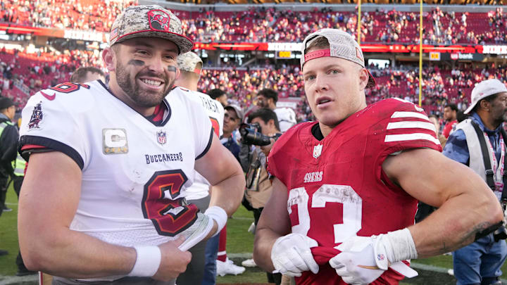 Nov 19, 2023; Santa Clara, California, USA; Tampa Bay Buccaneers quarterback Baker Mayfield (6) and San Francisco 49ers running back Christian McCaffrey (23) prepare to exchange jerseys after the game at Levi's Stadium. Mandatory Credit: Darren Yamashita-Imagn Images