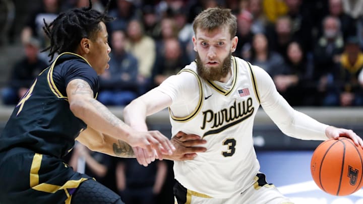 Northwestern Wildcats guard K.J. Windham (24) defends Purdue Boilermakers guard Braden Smith (3). Northwestern Wildcats guard K.J. Windham (24) defends Purdue Boilermakers guard Braden Smith (3).