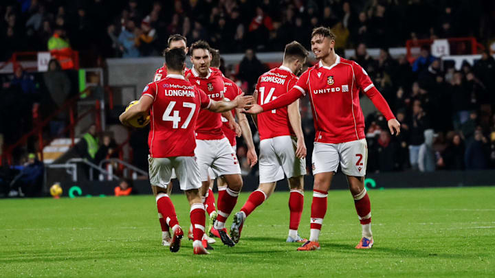 Wrexham survived an eight-goal thriller. Wrexham survived an eight-goal thriller.