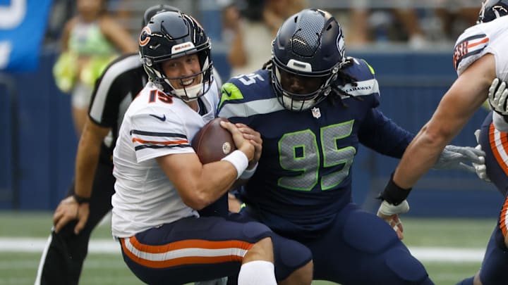 Aug 18, 2022; Seattle, Washington, USA; Seattle Seahawks defensive tackle Myles Adams (95) sacks Chicago Bears quarterback Trevor Siemian (15) during the second quarter at Lumen Field. Mandatory Credit: Joe Nicholson-Imagn Images