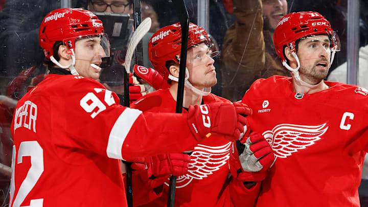 Jan 18, 2026; Detroit, Michigan, USA;  Detroit Red Wings left wing Lucas Raymond (23) is congratulated by teammates after scoring in the second period against the Ottawa Senators at Little Caesars Arena. Mandatory Credit: Rick Osentoski-Imagn Images