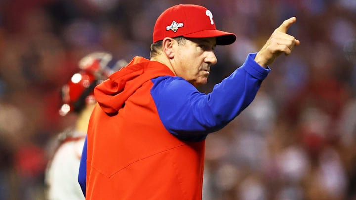 Oct 20, 2023; Phoenix, Arizona, USA; Philadelphia Phillies manager Rob Thomson signals to the bullpen during the seventh inning against the Arizona Diamondbacks in game four of the NLCS for the 2023 MLB playoffs at Chase Field