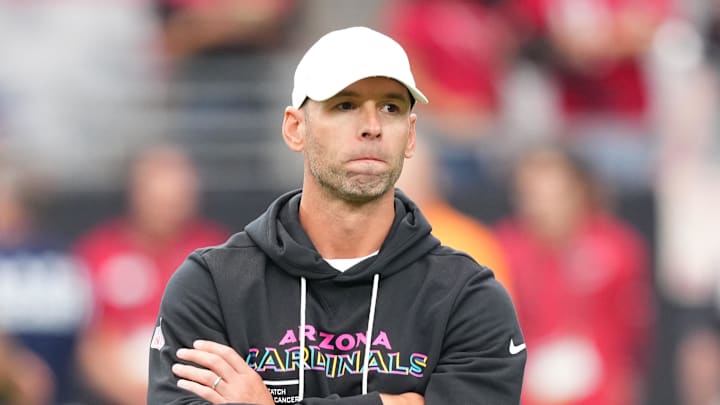 Oct 5, 2025; Glendale, Arizona, USA; Arizona Cardinals head coach Jonathan Gannon stands on the field before their game against the Tennessee Titans at State Farm Stadium. Mandatory Credit: Joe Camporeale-Imagn Images