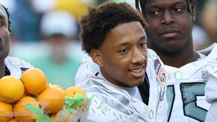 Jan 1, 2026; Miami Gardens, FL, USA; Oregon Ducks quarterback Dante Moore (5), wide receiver Malik Benson (4), defensive back Brandon Finney (4) and defensive lineman Bear Alexander (1) celebrate following the 2025 Orange Bowl and quarterfinal game of the College Football Playoff against the Texas Tech Red Raiders at Hard Rock Stadium. Mandatory Credit: Nathan Ray Seebeck-Imagn Images Jan 1, 2026; Miami Gardens, FL, USA; Oregon Ducks quarterback Dante Moore (5), wide receiver Malik Benson (4), defensive back Brandon Finney (4) and defensive lineman Bear Alexander (1) celebrate following the 2025 Orange Bowl and quarterfinal game of the College Football Playoff against the Texas Tech Red Raiders at Hard Rock Stadium. Mandatory Credit: Nathan Ray Seebeck-Imagn Images
