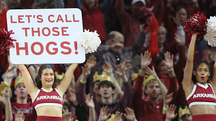 Arkansas Razorbacks fans and cheerleaders call the Hogs during the second half against the Florida Gators at Bud Walton Arena.