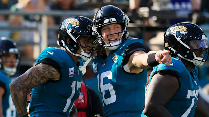 Jacksonville Jaguars quarterback Trevor Lawrence (16) celebrates with tight end Evan Engram (17) on his touchdown catch during the fourth quarter of an NFL football matchup Sunday, Oct. 27, 2024 at EverBank Stadium in Jacksonville, Fla. The Packers edged the Jaguars 30-27 on a last-second field goal. [Corey Perrine/Florida Times-Union]