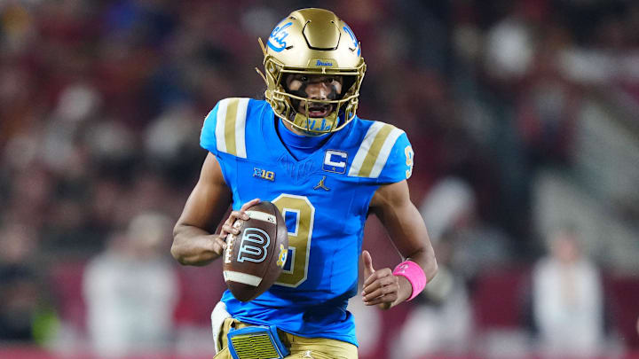 Nov 29, 2025; Los Angeles, California, USA; UCLA Bruins quarterback Nico Iamaleava (9) carries the ball against the Southern California Trojans in the first half at United Airlines Field at Los Angeles Memorial Coliseum. Mandatory Credit: Kirby Lee-Imagn Images