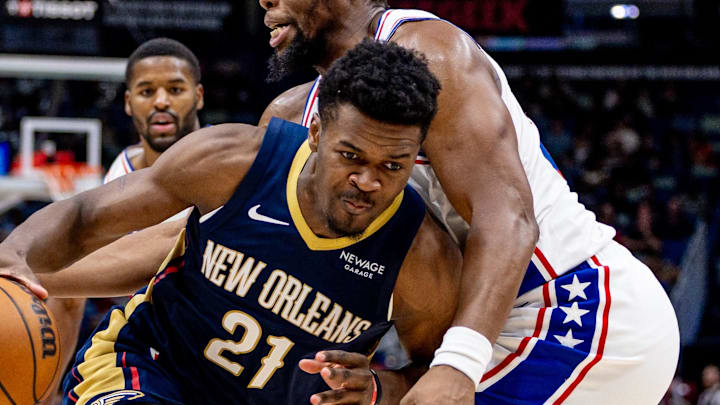 Mar 24, 2025; New Orleans, Louisiana, USA;  New Orleans Pelicans center Yves Missi (21) dribbles against Philadelphia 76ers forward Guerschon Yabusele (28) during the second half at Smoothie King Center. Mandatory Credit: Stephen Lew-Imagn Images