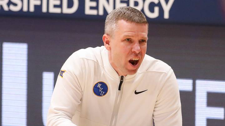 Feb 18, 2026; Morgantown, West Virginia, USA; West Virginia Mountaineers head coach Ross Hodge yells from the sideline during the first half against the Utah Utes at Hope Coliseum. Mandatory Credit: Ben Queen-Imagn Images