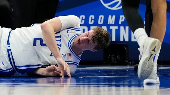 Mar 13, 2025; Charlotte, NC, USA; Duke Blue Devils forward Cooper Flagg (2) is injured in the first half at Spectrum Center. Mandatory Credit: Bob Donnan-Imagn Images Mar 13, 2025; Charlotte, NC, USA; Duke Blue Devils forward Cooper Flagg (2) is injured in the first half at Spectrum Center. Mandatory Credit: Bob Donnan-Imagn Images