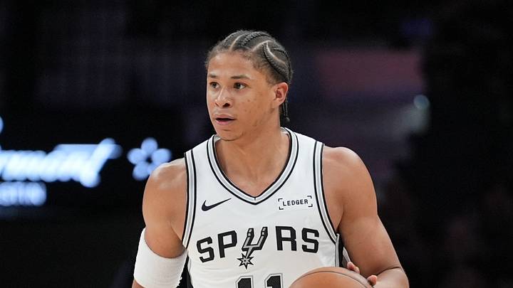 Oct 14, 2026; San Antonio, Texas, USA;  San Antonio Spurs forward Carter Bryant (11) dribbles up the court in the first half against the Phoenix Suns at Frost Bank Center.  Mandatory Credit: Daniel Dunn-Imagn Images