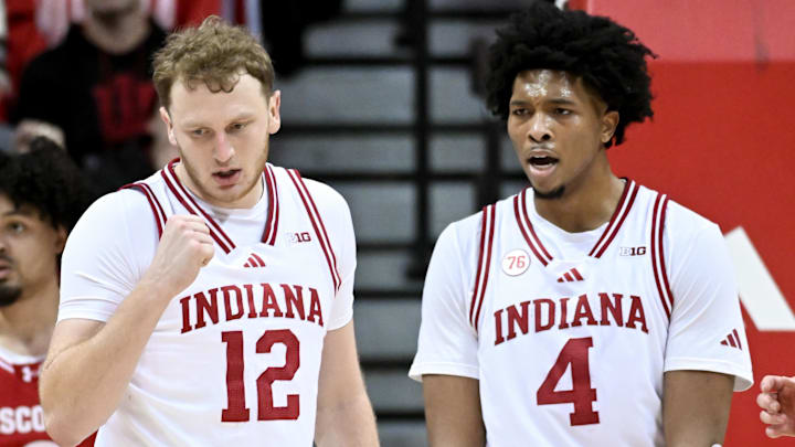 Indiana Hoosiers forwards Tucker DeVries (12) and Sam Alexis (4) celebrates against the Wisconsin Badgers at Simon Skjodt Assembly Hall. 