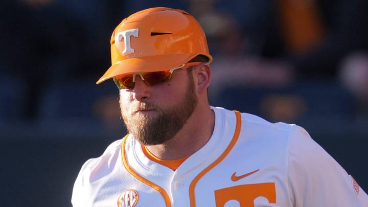 Tennessee baseball coach Josh Elander runs out to his spot at third base during the NCAA college baseball game against Nicholls on Feb. 13, 2026, in Knoxville, Tennessee.