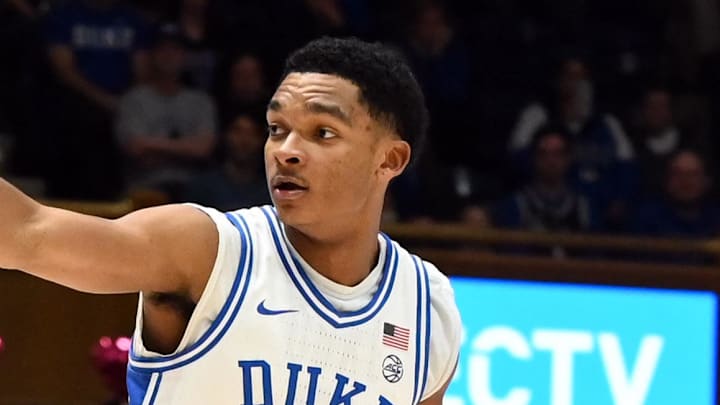 Feb 14, 2026; Durham, North Carolina, USA;Duke Blue Devils guard Caleb Foster (1) directs the offense as Clemson Tigers guard Jestin Porter (1) defends during the second half at Cameron Indoor Stadium. Mandatory Credit: Rob Kinnan-Imagn Images