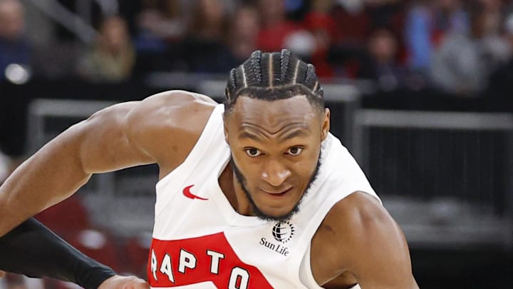 Toronto Raptors guard Immanuel Quickley drives to the basket against Chicago Bulls guard Tre Jones.