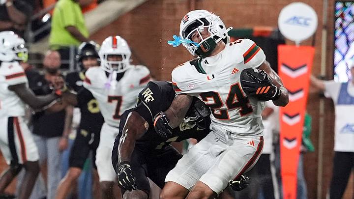 Sep 18, 2026; Winston-Salem, North Carolina, USA; Miami (FL) Hurricanes defensive back Ethan O'Connor (24) intercepts a pass near the end zone tackled by Wake Forest Demon Deacons running back Kd Daniels (1)during the second half at Allegacy Federal Credit Union Stadium. Mandatory Credit: Jim Dedmon-Imagn Images Sep 18, 2026; Winston-Salem, North Carolina, USA; Miami (FL) Hurricanes defensive back Ethan O'Connor (24) intercepts a pass near the end zone tackled by Wake Forest Demon Deacons running back Kd Daniels (1)during the second half at Allegacy Federal Credit Union Stadium. Mandatory Credit: Jim Dedmon-Imagn Images