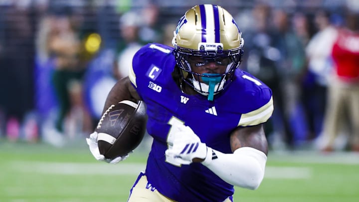 Aug 30, 2025; Seattle, Washington, USA; Washington Huskies running back Jonah Coleman (1) rushes for a touchdown against the Colorado State Rams during the first quarter at Husky Stadium. 