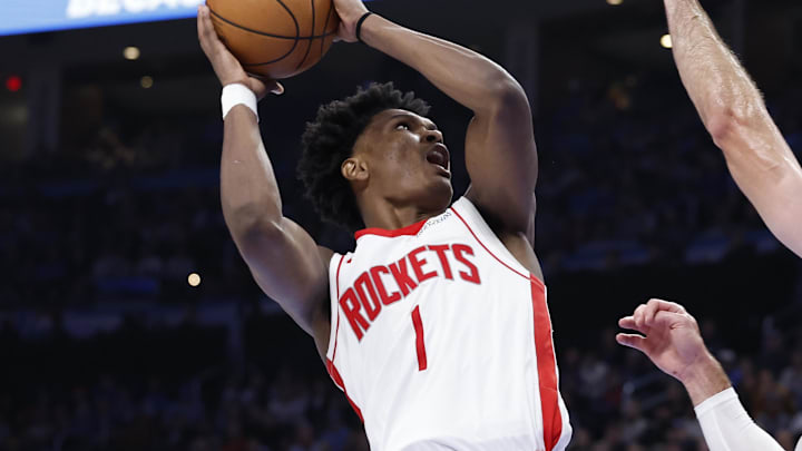 Nov 8, 2024; Oklahoma City, Oklahoma, USA; Houston Rockets forward Amen Thompson (1) shoots as Oklahoma City Thunder guard Alex Caruso (9) defends during the second half at Paycom Center. Mandatory Credit: Alonzo Adams-Imagn Images