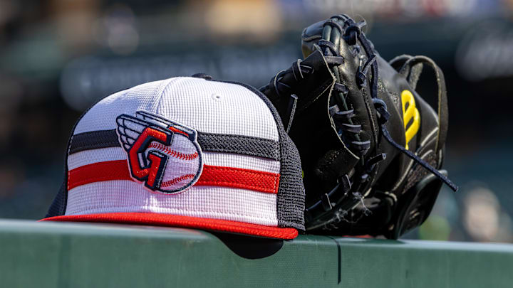 Jul 8, 2024; Detroit, Michigan, USA; A Cleveland Guardians baseball cap and glove sit on the dugout rail before the game against the Detroit Tigers at Comerica Park. Mandatory Credit: David Reginek-Imagn Images Jul 8, 2024; Detroit, Michigan, USA; A Cleveland Guardians baseball cap and glove sit on the dugout rail before the game against the Detroit Tigers at Comerica Park. Mandatory Credit: David Reginek-Imagn Images