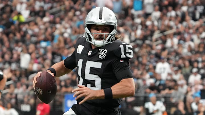 Sep 22, 2024; Paradise, Nevada, USA; Las Vegas Raiders quarterback Gardner Minshew (15) throws the ball against the Carolina Panthers in the first half at Allegiant Stadium. Mandatory Credit: Kirby Lee-Imagn Images