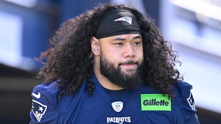 Jul 23, 2025; Foxborough, MA, USA; New England Patriots defensive tackle Khyiris Tonga (95)  walks to the practice field for training camp at Gillette Stadium. Mandatory Credit: Eric Canha-Imagn Images
