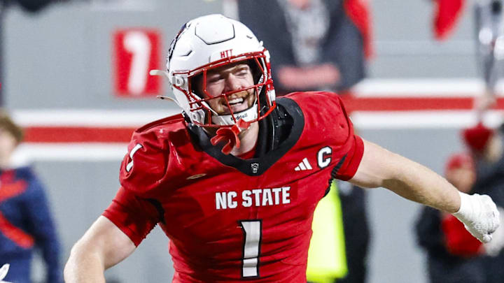 Nov 29, 2025; Raleigh, North Carolina, USA; NC State Wolfpack linebacker Caden Fordham (1) reacts to a down with NC State Wolfpack wide receiver Sam Dodd (28) and NC State Wolfpack quarterback Cole Wilson (19) during the second half of the game against North Carolina Tar Heels at Carter-Finley Stadium. Mandatory Credit: Jaylynn Nash-Imagn Images Nov 29, 2025; Raleigh, North Carolina, USA; NC State Wolfpack linebacker Caden Fordham (1) reacts to a down with NC State Wolfpack wide receiver Sam Dodd (28) and NC State Wolfpack quarterback Cole Wilson (19) during the second half of the game against North Carolina Tar Heels at Carter-Finley Stadium. Mandatory Credit: Jaylynn Nash-Imagn Images