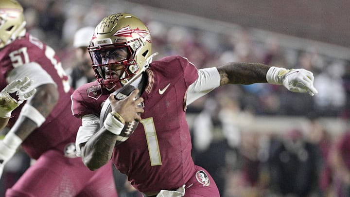 Nov 15, 2025; Tallahassee, Florida, USA; Florida State Seminoles quarterback Thomas Castellanos (1) runs the ball past Virginia Tech Hokies defensive lineman Kelvin Gilliam Jr. (22) during the first half at Doak S. Campbell Stadium. Mandatory Credit: Melina Myers-Imagn Images