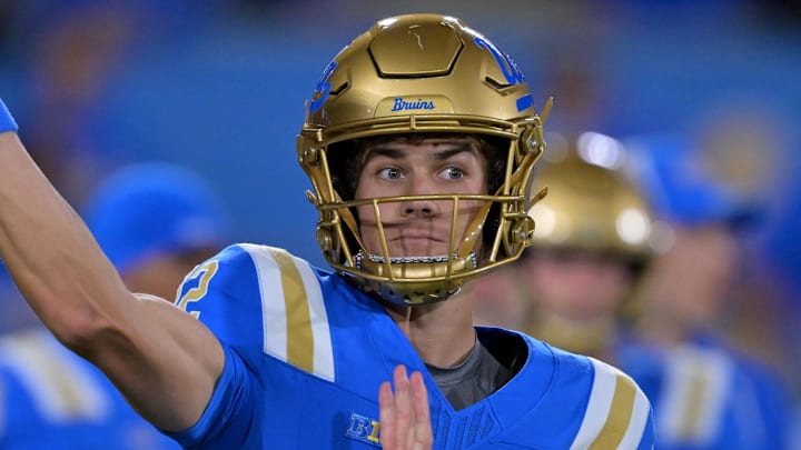 Nov 22, 2025; Pasadena, California, USA;  UCLA Bruins quarterback Luke Duncan (12) warms up prior to the game against the Washington Huskies at the Rose Bowl. Mandatory Credit: Jayne Kamin-Oncea-Imagn Images
