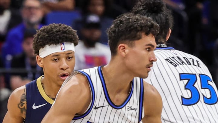 Orlando Magic forward Tristan da Silva moves the ball in front of New Orleans Pelicans guard Jeremiah Fears. Orlando Magic forward Tristan da Silva moves the ball in front of New Orleans Pelicans guard Jeremiah Fears.