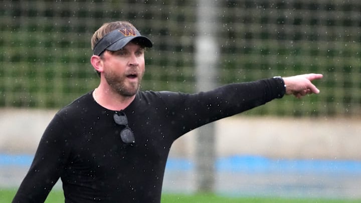 Nov 13, 2025; Madrid, Spain; Washington Commanders tight ends coach David Raih gestures during practice at Ciudad Deportiva del Real Madrid. Mandatory Credit: Kirby Lee-Imagn Images