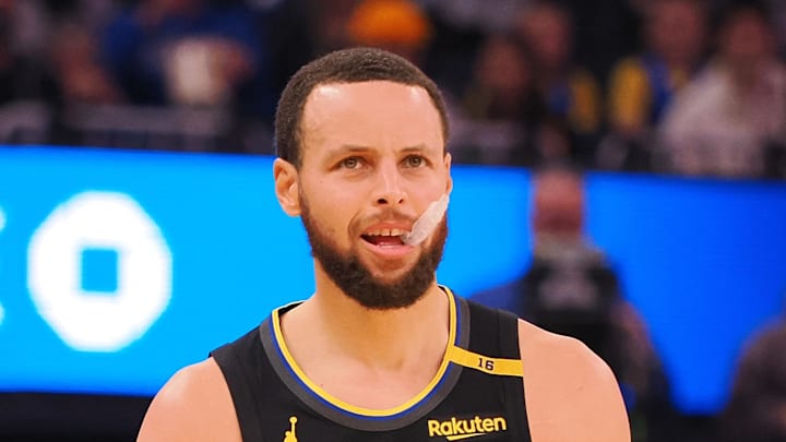 Feb 3, 2025; San Francisco, California, USA; Golden State Warriors guard Stephen Curry (30) between plays against the Orlando Magic during the first quarter at Chase Center. Mandatory Credit: Kelley L Cox-Imagn Images