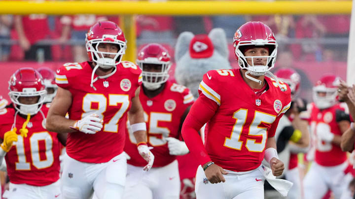 Aug 22, 2025; Kansas City, Missouri, USA; Led by Kansas City Chiefs quarterback Patrick Mahomes (15), the team runs on field prior to a game at GEHA Field at Arrowhead Stadium. Mandatory Credit: Denny Medley-Imagn Images
