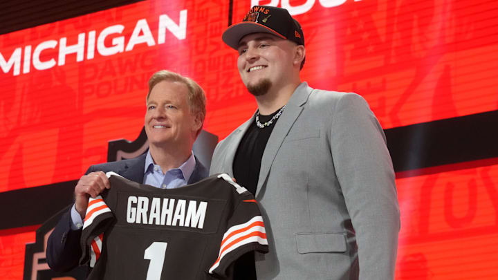 Apr 24, 2025; Green Bay, WI, USA; NFL commissioner Roger Goodell with Michigan Wolverines defensive lineman Mason Graham after he is selected by the Cleveland Browns as the number five pick in the first round of the 2025 NFL Draft at Lambeau Field. Mandatory Credit: Kirby Lee-Imagn Images