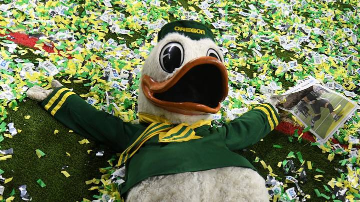 Dec 7, 2024; Indianapolis, IN, USA; The Oregon Duck mascot makes snow angels in confetti after defeating the Penn State Nittany Lions to win the Big Ten Championship in the 2024 Big Ten Championship game at Lucas Oil Stadium. Mandatory Credit: Robert Goddin-Imagn Images Dec 7, 2024; Indianapolis, IN, USA; The Oregon Duck mascot makes snow angels in confetti after defeating the Penn State Nittany Lions to win the Big Ten Championship in the 2024 Big Ten Championship game at Lucas Oil Stadium. Mandatory Credit: Robert Goddin-Imagn Images