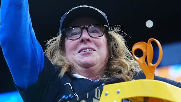 Apr 5, 2026; Phoenix, AZ, USA; UCLA Bruins head coach Cori Close cuts down the net after defeating the South Carolina Gamecocks during the National Championship game of the women's 2026 NCAA Tournament at Mortgage Matchup Center. Mandatory Credit: Kirby Lee-Imagn Images