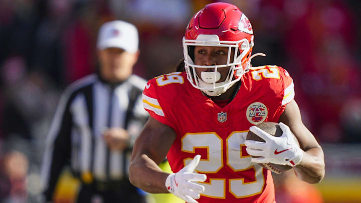 Dec 14, 2025; Kansas City, Missouri, USA; Kansas City Chiefs running back Kareem Hunt (29) rushes against the Los Angeles Chargers during the first quarter at GEHA Field at Arrowhead Stadium.