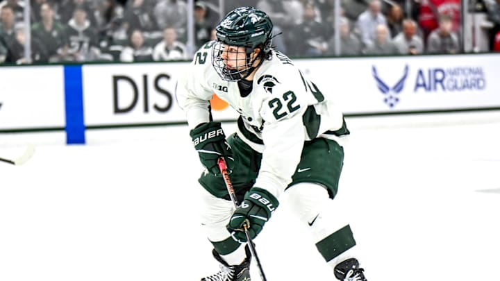 Michigan State's Isaac Howard moves the puck against Ohio State in the second period of the Big Ten tournament game on Saturday, March 16, 2024, at Munn Arena in East Lansing.