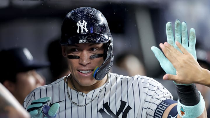 Sep 24, 2025; Bronx, New York, USA; New York Yankees right fielder Aaron Judge (99) celebrates his solo home run against the Chicago White Sox with teammates in the dugout during the eighth inning at Yankee Stadium. Mandatory Credit: Brad Penner-Imagn Images