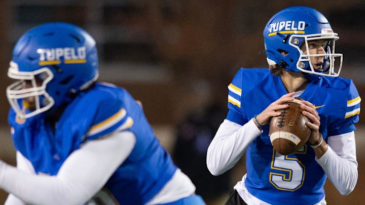 Tupelo quarterback Noah Gillon (5) looks for an opening during play against Brandon in the MHSAA 7A championship game in Hattiesburg, Miss., Thursday, Dec. 5, 2024.